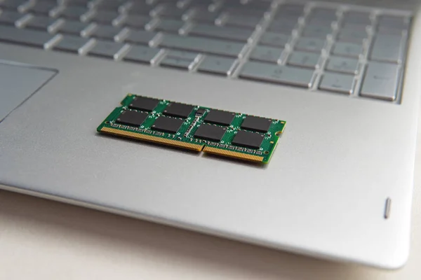 DDR3 sodimm RAM memory card module in black laptop closeup