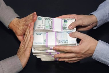 A million rubles in men's hands. Bribery in Russian rubles in a dark room. The concept of corruption and bribery. rejection of money. honest official refuses a bribe. clipart