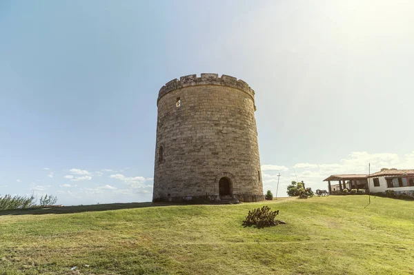 Old vintage abandoned antique watch tower against clear blue sky at Varadero Cuban — Stockfoto