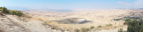 View from top of the Mount Nebo to the Jordanian desert valley. Desert land around the dead sea. panoramic view