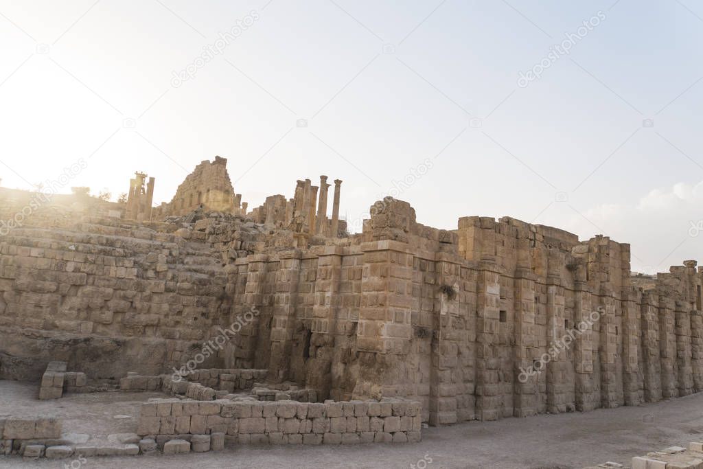 Temple of Artemis in the ancient Roman city of Gerasa preset-day Jerash, Jordan. High columns of the Roman era against the blue sky. Ancient ruins in the city of Jarash. Sightseeing in Jordan.