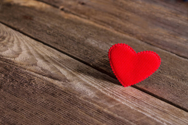 Valentines day red heart on old wood