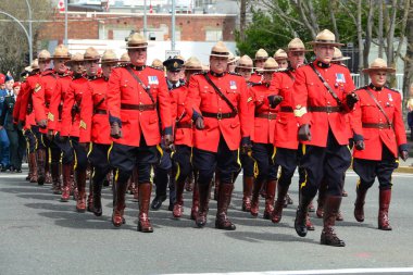 Victoria BC,Canada,April 19th 2018.RCMP officers march in unison to the church in honor of a fallen officer. clipart
