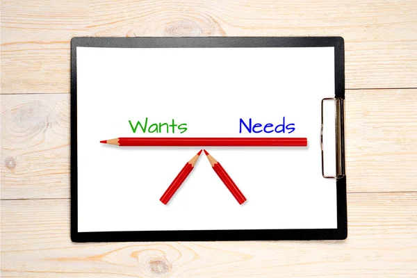 Wants needs balance concept — Stock Photo, Image