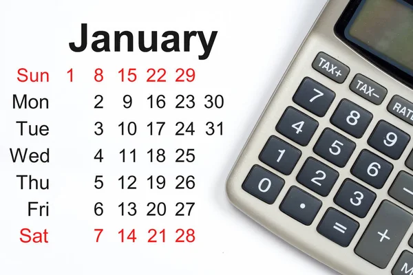 Calendario de enero, calculadora con botones de impuestos —  Fotos de Stock