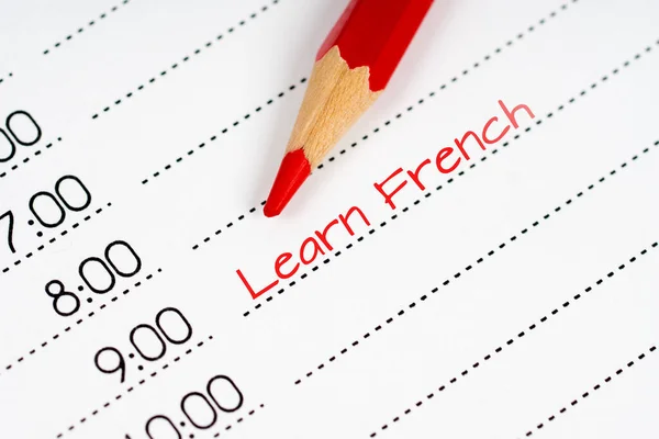 赤い鉛筆でフランス語を学び — ストック写真