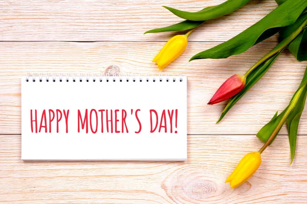 happy mother\'s day, greetings on rustic planks with tulips