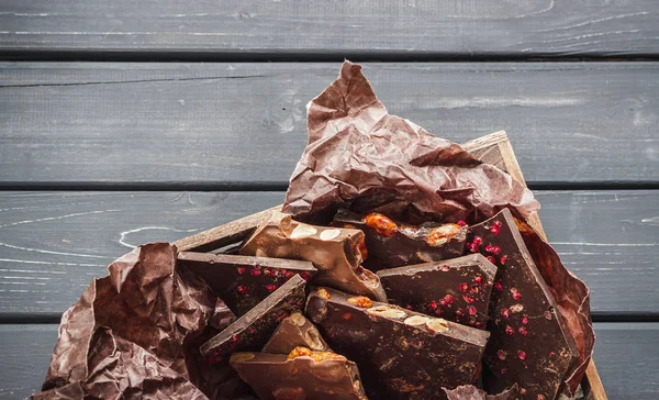 Variety of chocolate bars in wooden box