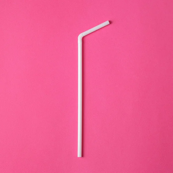 Two white plastic straws on pink background — ストック写真