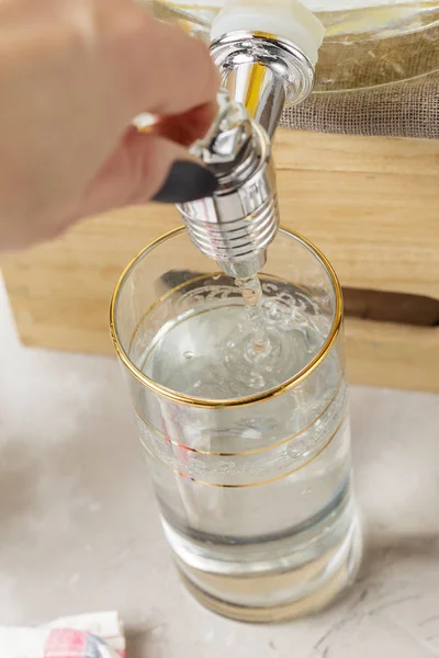 Fresh clean water is poured into drinking glass — Zdjęcie stockowe