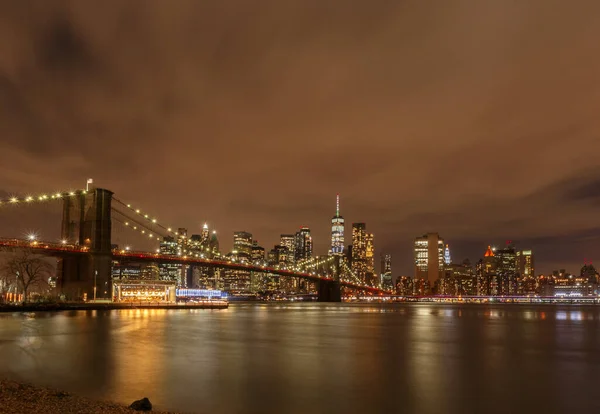 Brooklyn Bridge and Lower Manhattan at night. View from Dumbo Park, New York City, USA