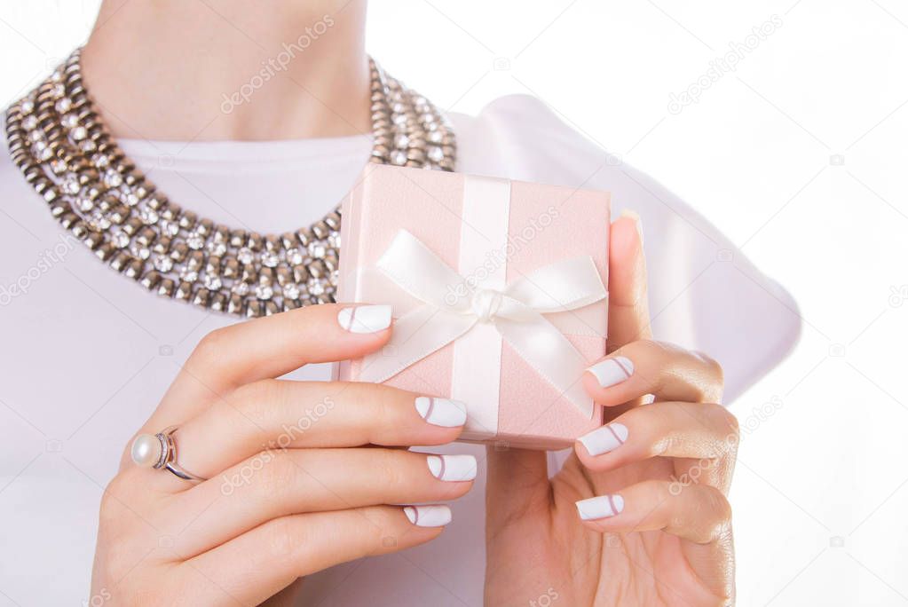 Woman holds a small gift