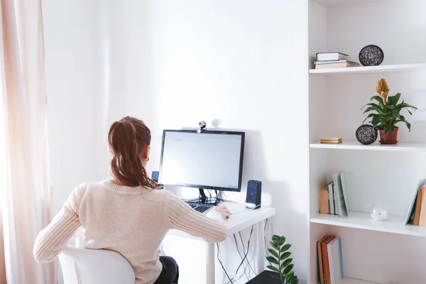 Workspace of business woman. Woman works on computer in light sunny room . Modern design with white furniture — Stock Photo, Image