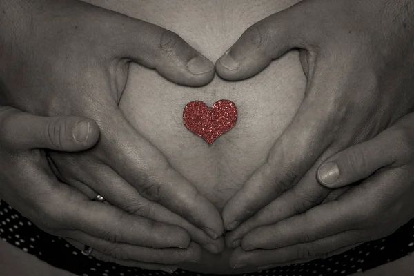 Baby belly with hands — Stock Photo, Image