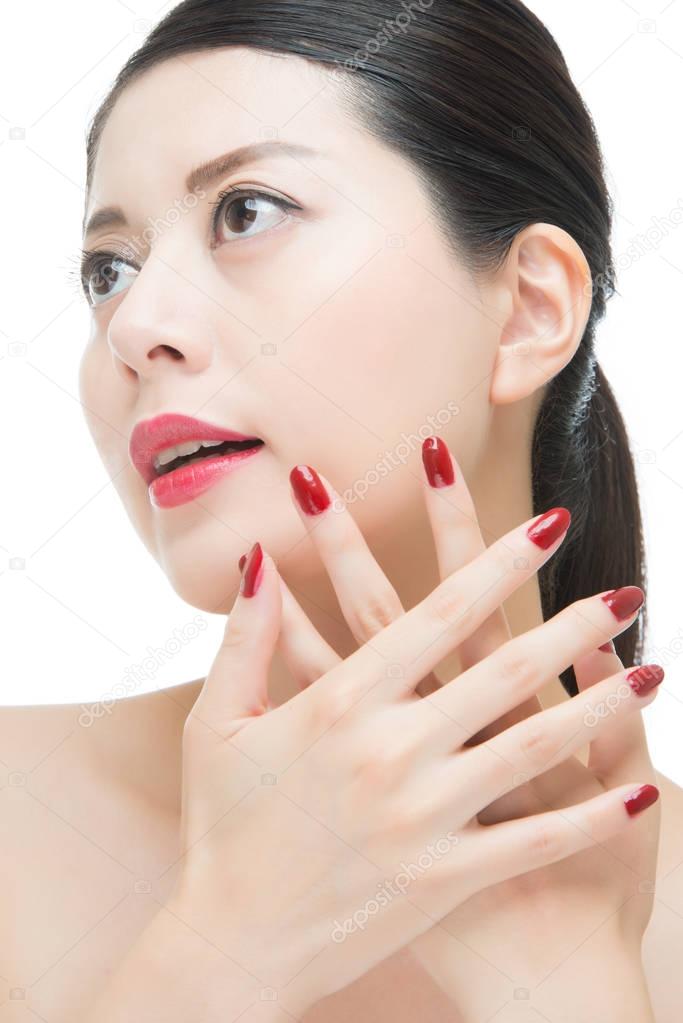 asian woman with fashion red nails polish and sensual lips