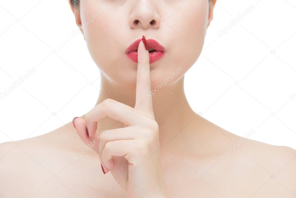 asian woman red lipstick and finger showing hush silence sign