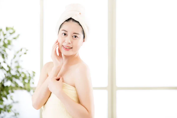 Charming asian woman drying towel on head after shower — Stockfoto