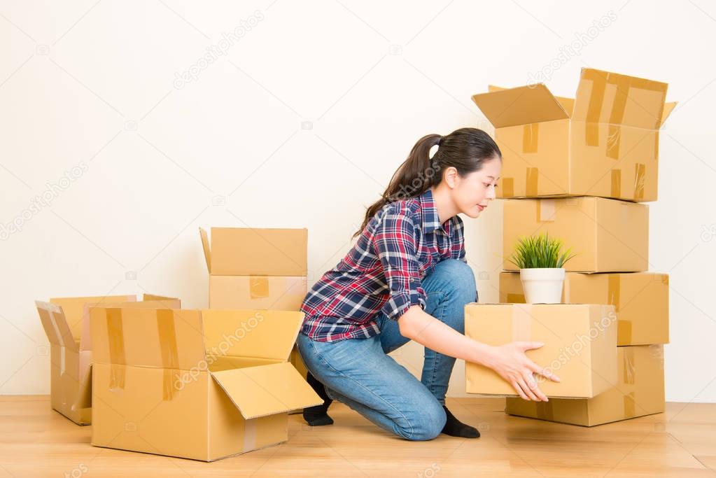 Woman packing and unpacking belongings