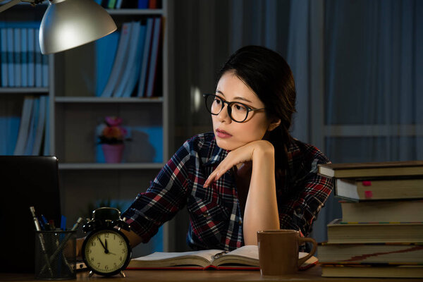 bored female college student studying