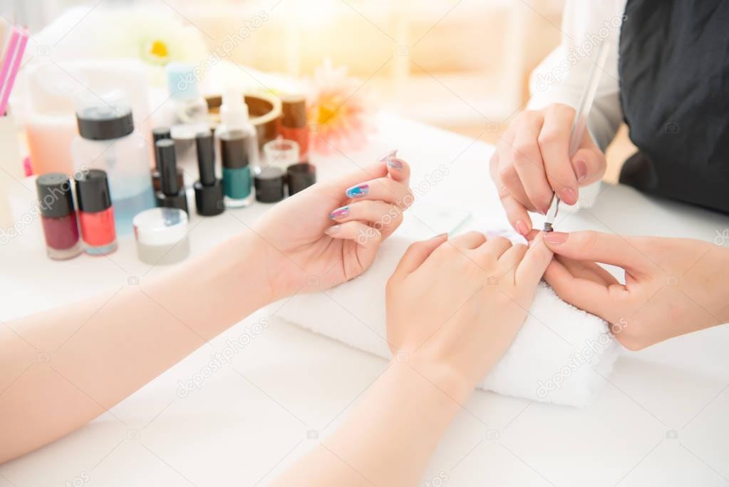 coloring nail by professional manicure