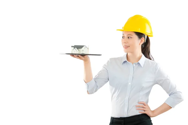 Young woman designer showing house model — Stock Photo, Image