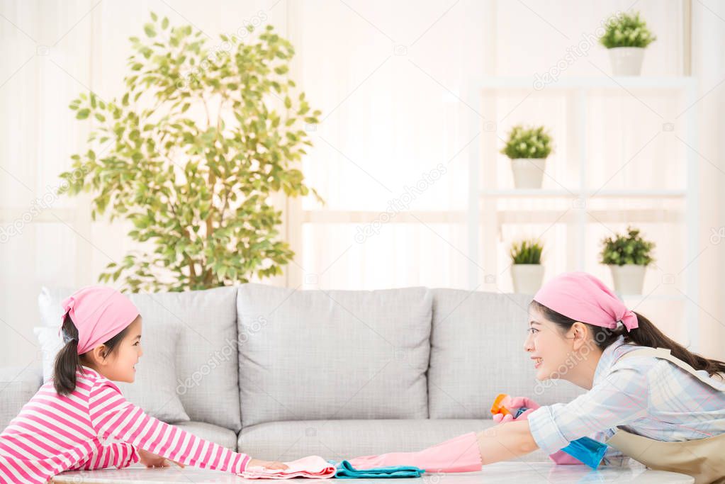 mother and kids playing and cleaning