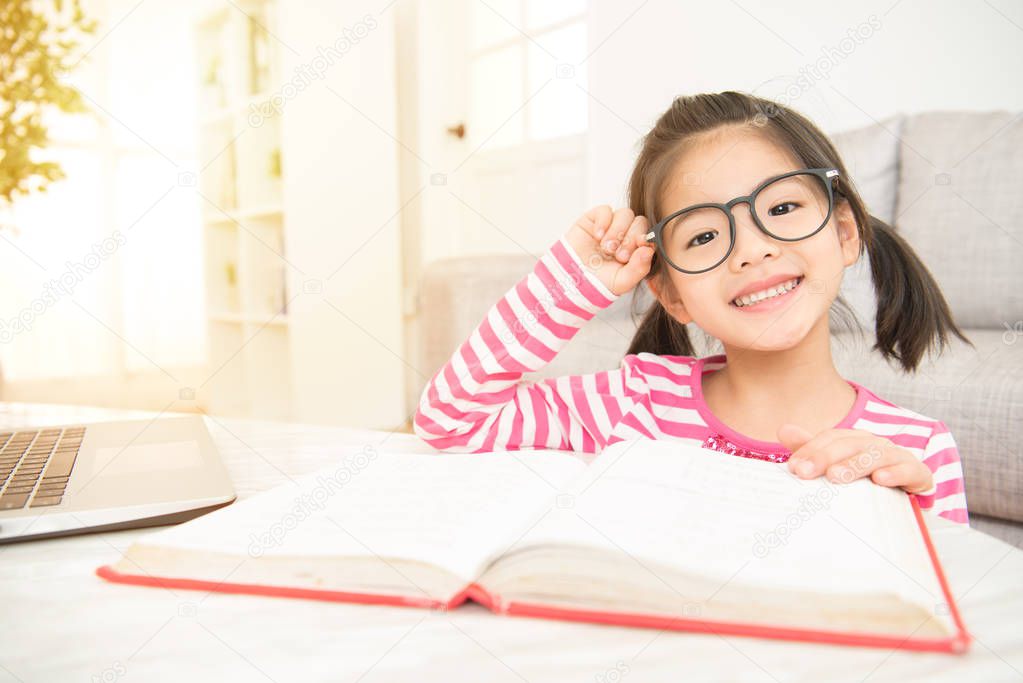 smile girl holding glasses reading a books