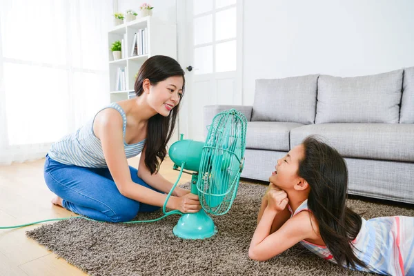 Children girl lying down on living room floor — Stock Photo, Image