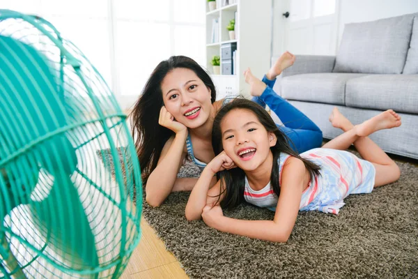 Happy mother and daughter making same posing — Stock Photo, Image
