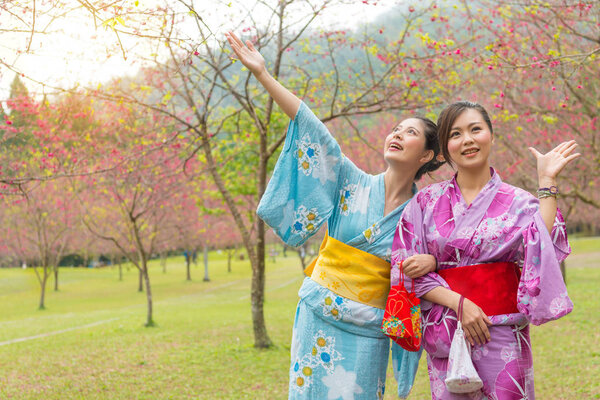 sweet smiling women wearing traditional kimono