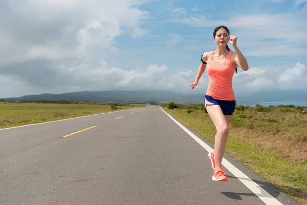 Professional player on the long asphalt road — Stock Photo, Image