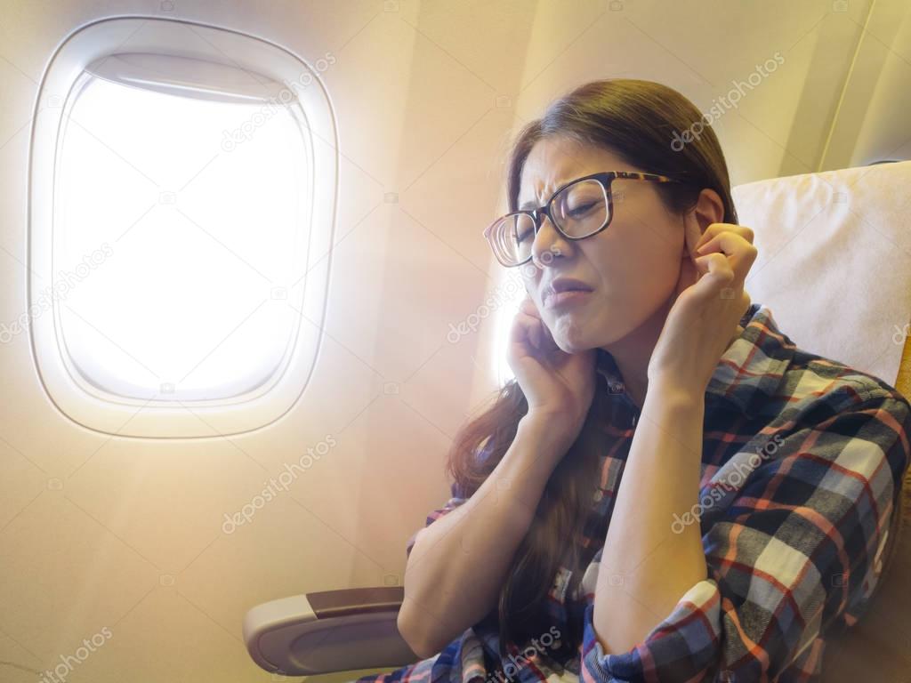 lovely sweet female traveler feeling ear painful