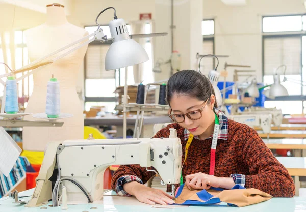 Young pretty female clothing designer doing work — Stock Photo, Image