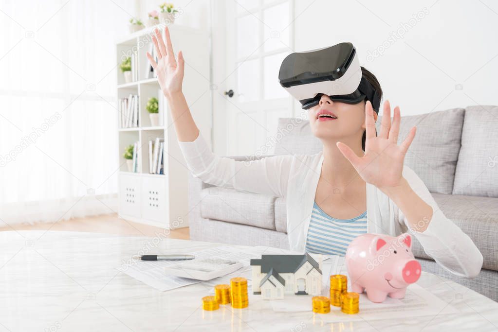 young housewife wearing VR technology device 