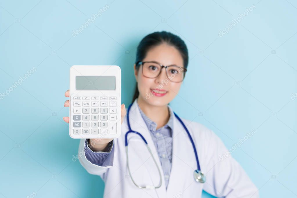 smiling confident woman doctor looking at camera
