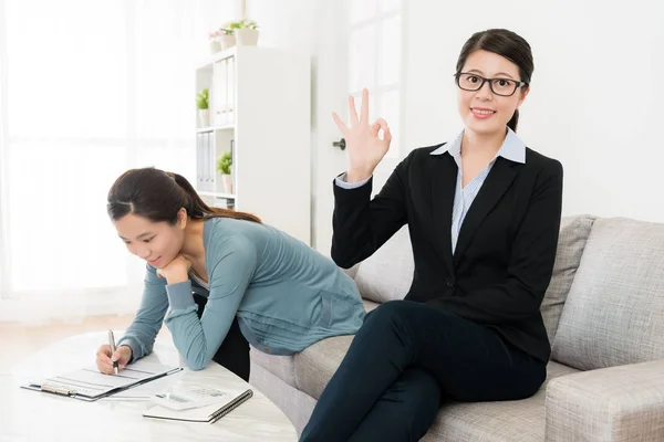 Professional business woman showing okay gesture — Stock Photo, Image