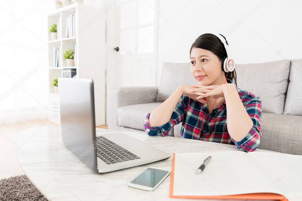 elegant female student watching e-learning video