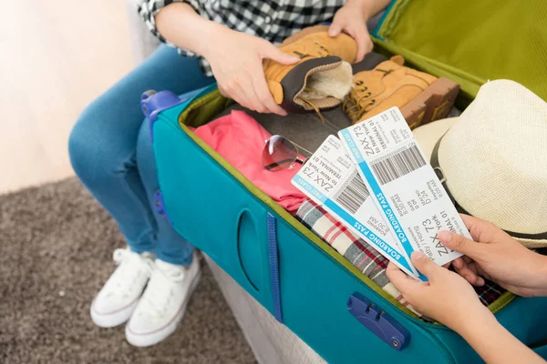 two female people organized personal luggage