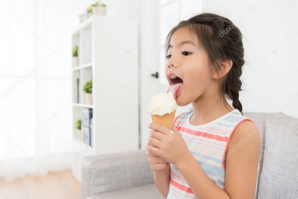 young pretty female children eating ice cream