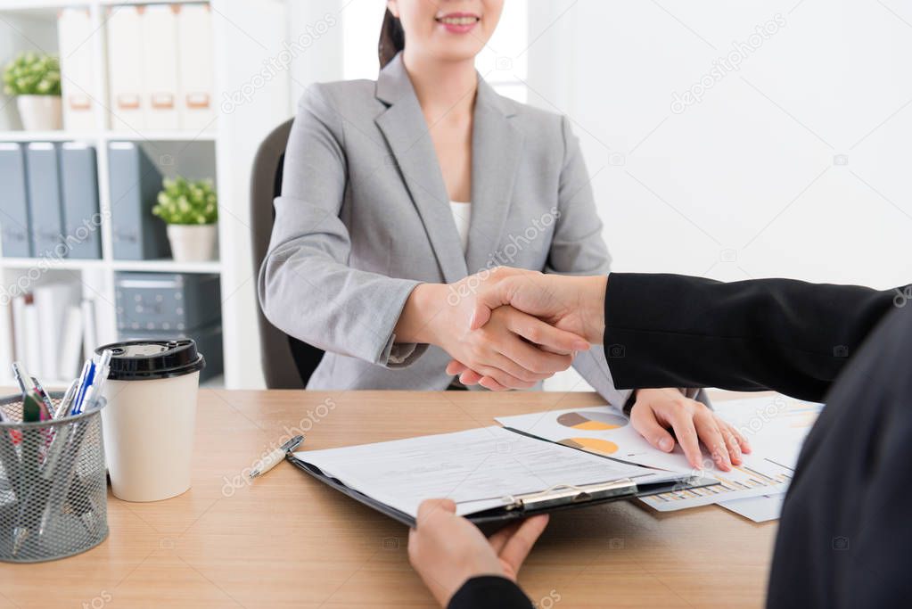 two business people woman handshake together