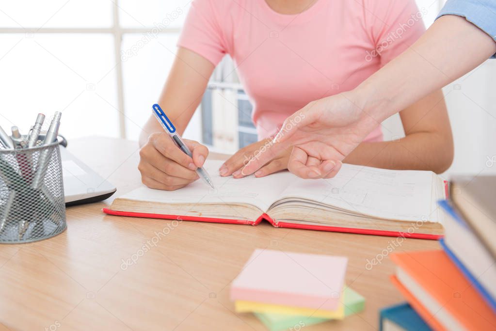 student doing school homework with home tutor