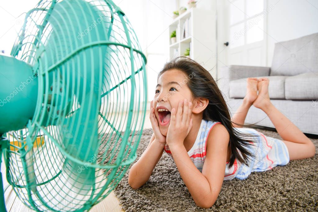 beautiful little kid girl lying down on floor