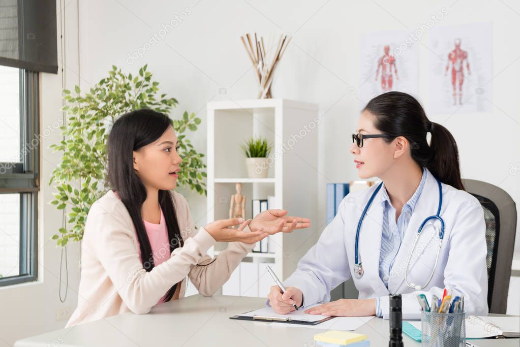 pretty elegant patient talking with doctor woman