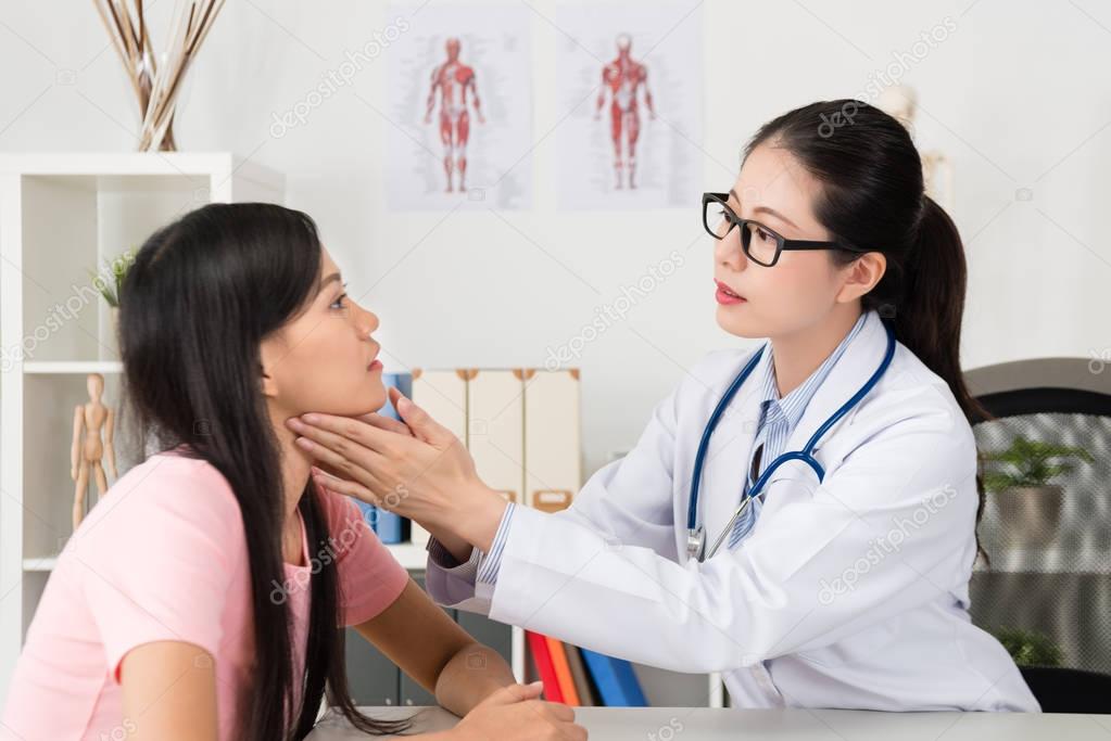 young beauty female doctor touching patient 
