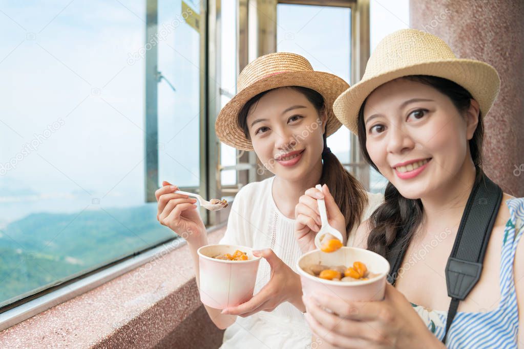 two girls love famous Taiwanese local food