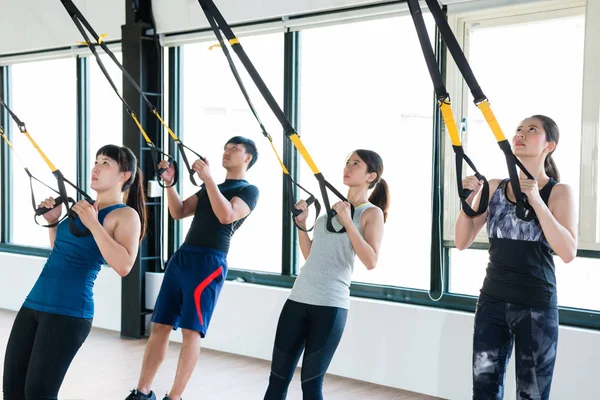 TRX total body resistance exercises trainer — Stock Photo, Image