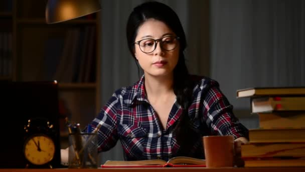 Concentrated Asian Young Woman Glasses Using Computer Studying Drinking Coffee — Stock Video