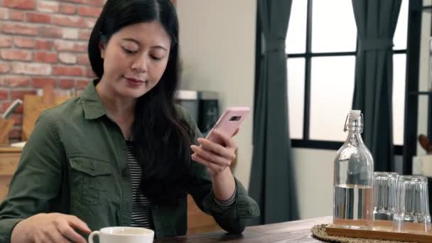 Girl Taps Her Cell Phone Drinking Coffee Excitement — Stock Video