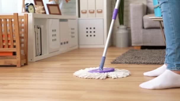 Woman Uses Mop Wipe Floor Back Forth Living Room Home — Stock Video
