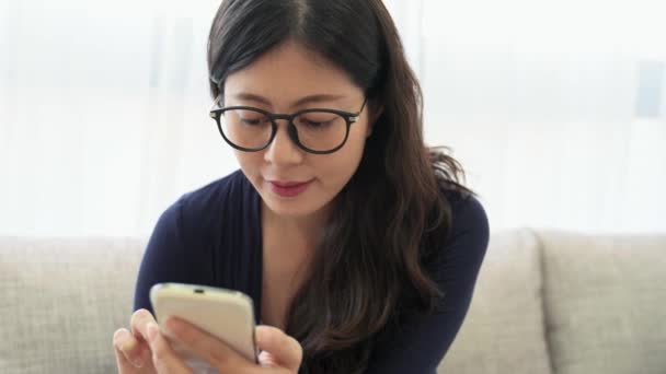 Close Smiling Young Woman Using Mobile Smartphone Browsing Online Information — Stock Video